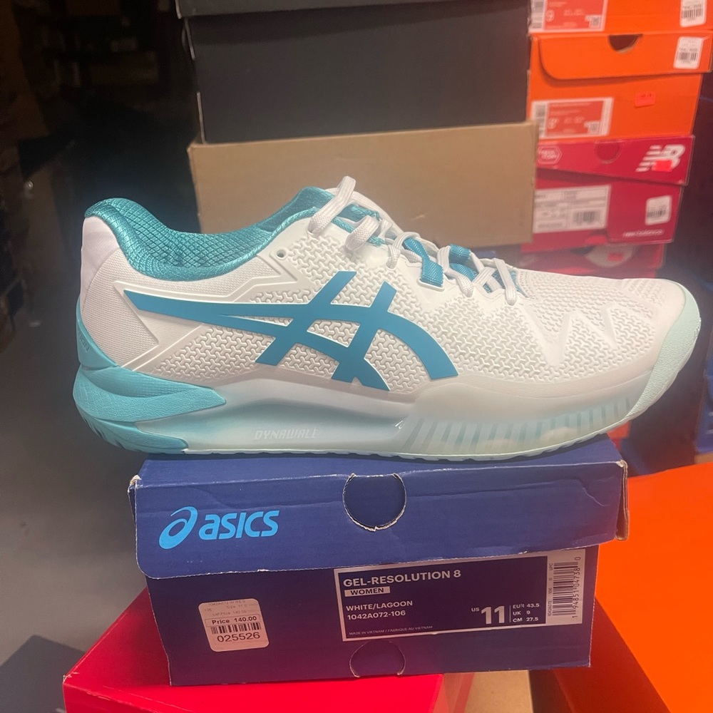 Asics tennis shose size 11W. 9.5M color white and blue